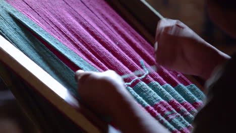Indigenous-woman-weaving-a-blanket