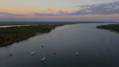 Drone-flight-over-sailboats-in-Costa-Del-Sol,-near-the-Pacific-Ocean-in-El-Salvador