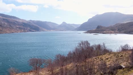 Vast-scenic-and-rugged-view-of-mountains-and-Loch-Gleann-Dubh-in-the-remote-wilderness-of-the-highlands-of-Scotland-UK