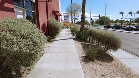 POV-Walking-Along-Pavement-Towards-A-Denny's-restaurant