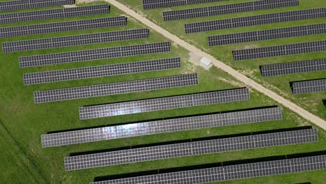 A-solar-panel-field-on-a-sunny-day,-aerial-view