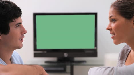 Couple-sitting-on-their-couch