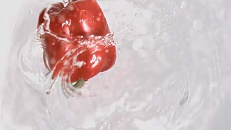 Pepper-falling-into-water-in-super-slow-motion