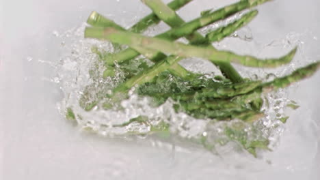 Asparagus-falling-into-water-in-super-slow-motion