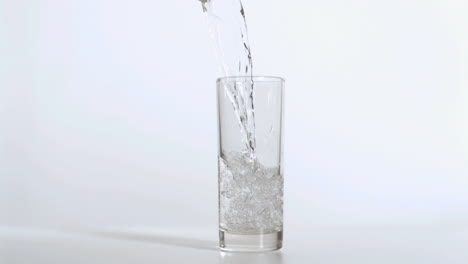 Glass-being-filled-in-super-slow-motion-with-water