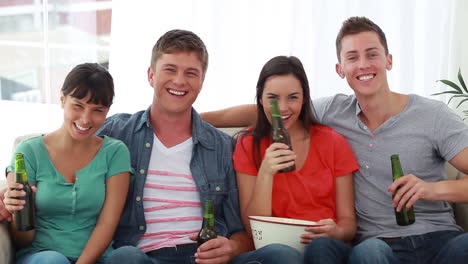 Two-couples-watching-the-television-together