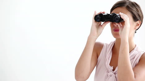 Welldressed-woman-looking-through-binoculars