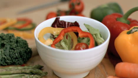 Pepper-slice-dropping-into-bowl-in-super-slow-motion