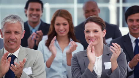 Business-people-applauding-during-a-meeting