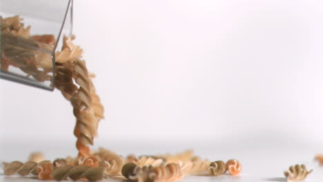 Pasta-coils-falling-down-in-super-slow-motion