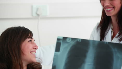 Smiling-patient-talking-to-her-doctor