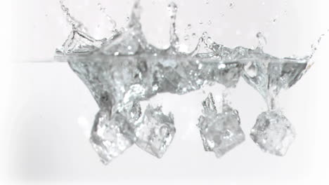 Ice-cubes-falling-into-water-in-super-slow-motion