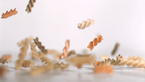 Pasta-coils-falling-down-in-super-slow-motion