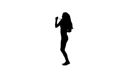 Silhouette-of-a-woman-dancing-and-having-fun