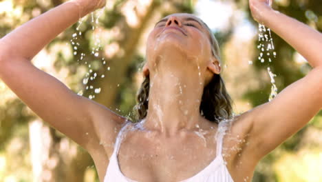 Woman-splashing-herself-in-slow-motion