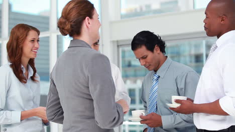 Colleagues-laughing-at-coffee-break