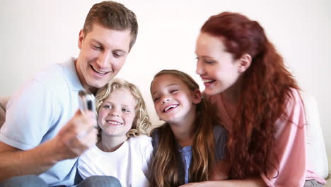 Man-photographing-his-family