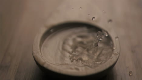 Water-drop-falling-in-super-slow-motion-into-a-spoon