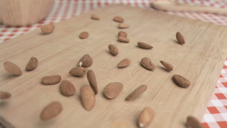 Almonds-being-spread-in-super-slow-motion