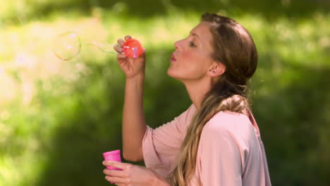 Woman-blowing-bubbles-in-slow-motion