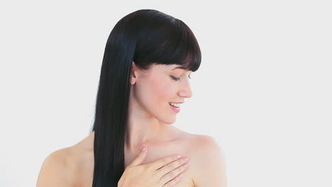 Peaceful-brunette-woman-massaging-her-shoulder