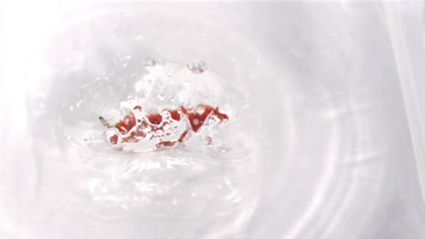 Chili-falling-into-water-in-super-slow-motion