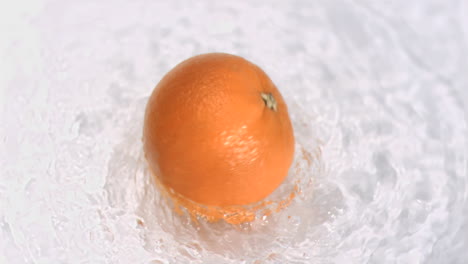 Orange-turning-in-water-in-super-slow-motion