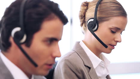 Call-centre-agent-talking-while-using-her-headset