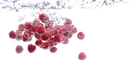 Raspberries-dropped-into-water-in-super-slow-motion