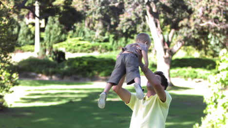 Man-in-slow-motion-lifting-his-son