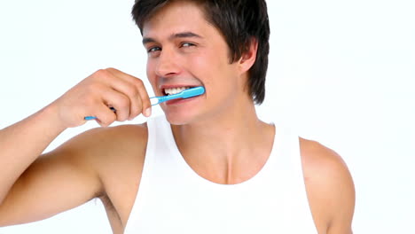 Man-brushing-and-looking-his-teeth