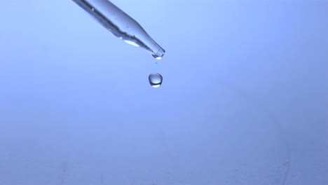 Droplet-falling-off-a-pipette-in-super-slow-motion