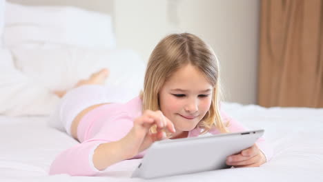 Blonde-girl-using-a-tablet-pc