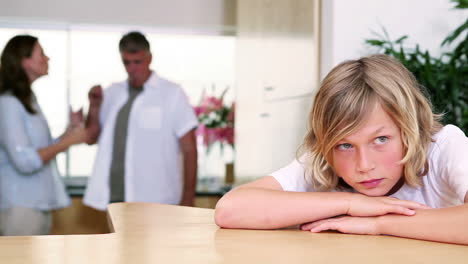 Little-boy-listening-to-his-parents-quarreling