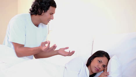 Couple-arguing-in-bed