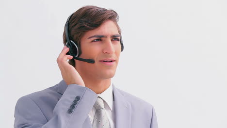 Handsome-businessman-talking-on-a-headset