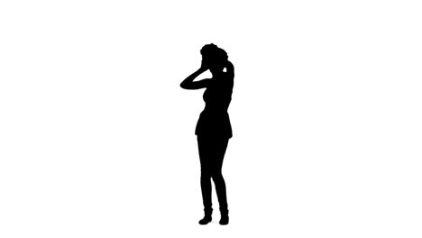 Silhouette-woman-dancing-with-her-hands-on-her-head
