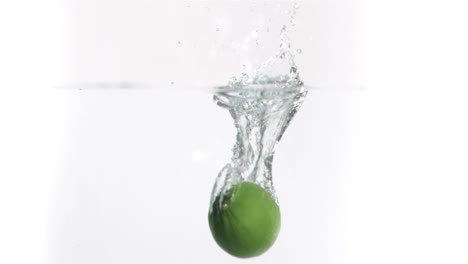 Lime-falling-into-water-in-super-slow-motion