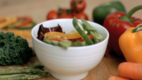 Pepper-slices-falling-into-bowl-in-super-slow-motion