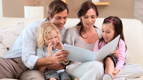 Smiling-family-reading-a-book