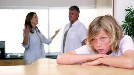 Little-boy-listening-to-his-parents-having-a-fight