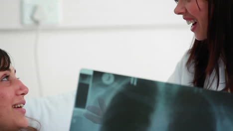 Happy-patient-looking-at-her-Xray-scan