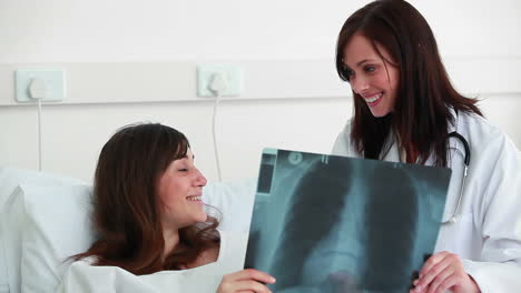 Smiling-doctor-talking-to-a-patient