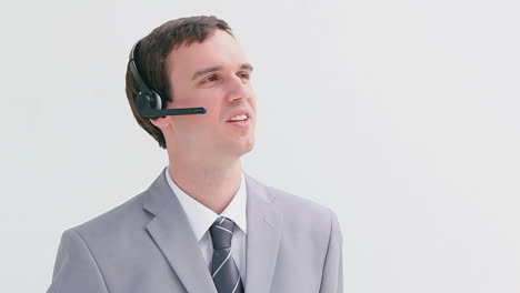 Happy-businessman-using-a-headset