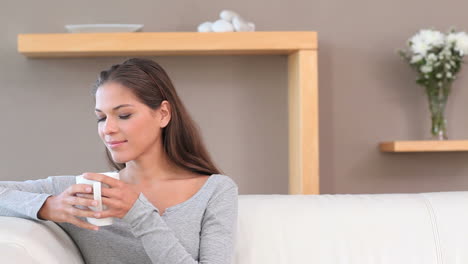 Brunette-woman-drinking-a-tea