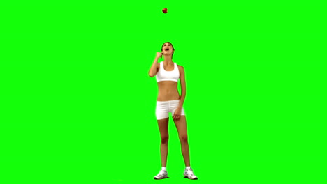 Brunette-woman-in-slow-motion-throwing-an-apple