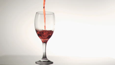 Red-wine-filling-in-super-slow-motion-a-glass-of-wine