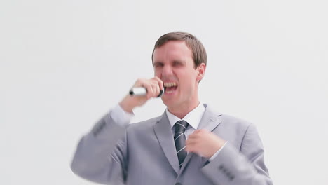 Businessman-singing-into-a-cordless-microphone
