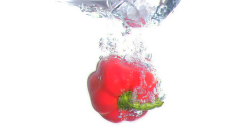 Peppers-submerged-into-water-in-super-slow-motion