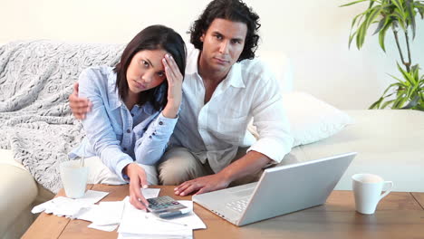 Man-reassuring-his-wife-about-bills